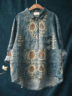 ZOFIA ATELIER blue spandex shirt with vintage animal print and button-up front.