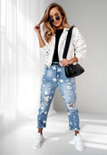 ZOFIA ATELIER blue denim trousers with white stars and distressed details, slim fit, straight cut.