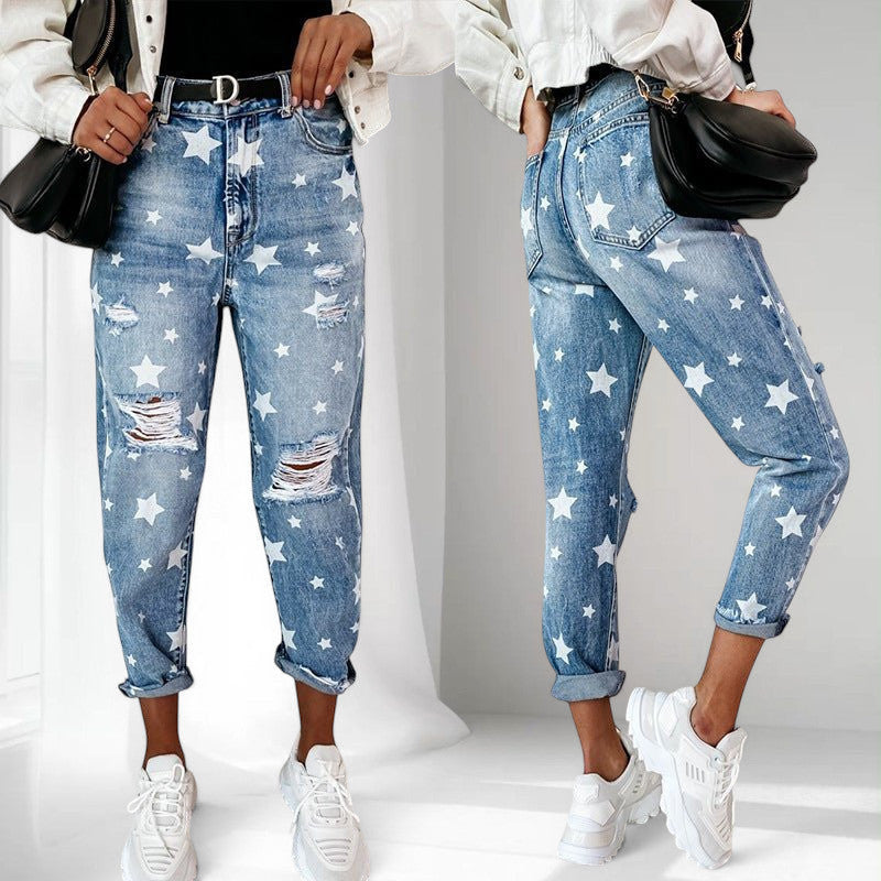 ZOFIA ATELIER blue denim trousers with white star print and distressed details, slim fit, straight leg.