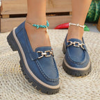ZOFIA ATELIER blue suede chunky platform loafers with gold chain detail and white stitching.