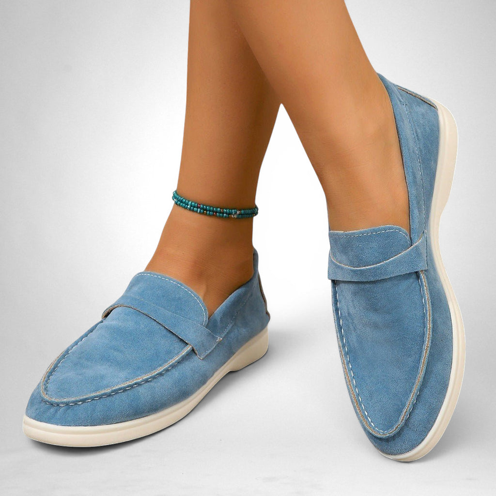 ZOFIA ATELIER light blue suede retro slip-on flats with white stitching and a flexible sole.