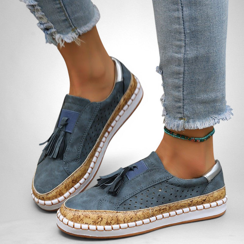 ZOFIA ATELIER blue artificial PU tassel round toe flats with perforated details and cork trim.