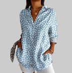 ZOFIA ATELIER light blue button-up blouse with white abstract print, relaxed fit, and two front pockets.