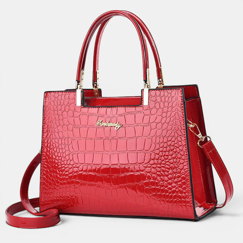 ZOFIA ATELIER Dominika bolsa de ombro em pele vermelha com acabamento brilhante e textura de crocodilo. Estrutura média-dura com fecho de correr.