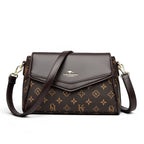 ZOFIA ATELIER bolsa tiracolo retangular em PU castanho com padrão de monograma e fecho de aba.