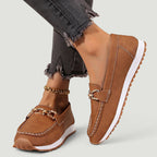 ZOFIA ATELIER brown faux suede chain platform loafers with white stitching and gold hardware.