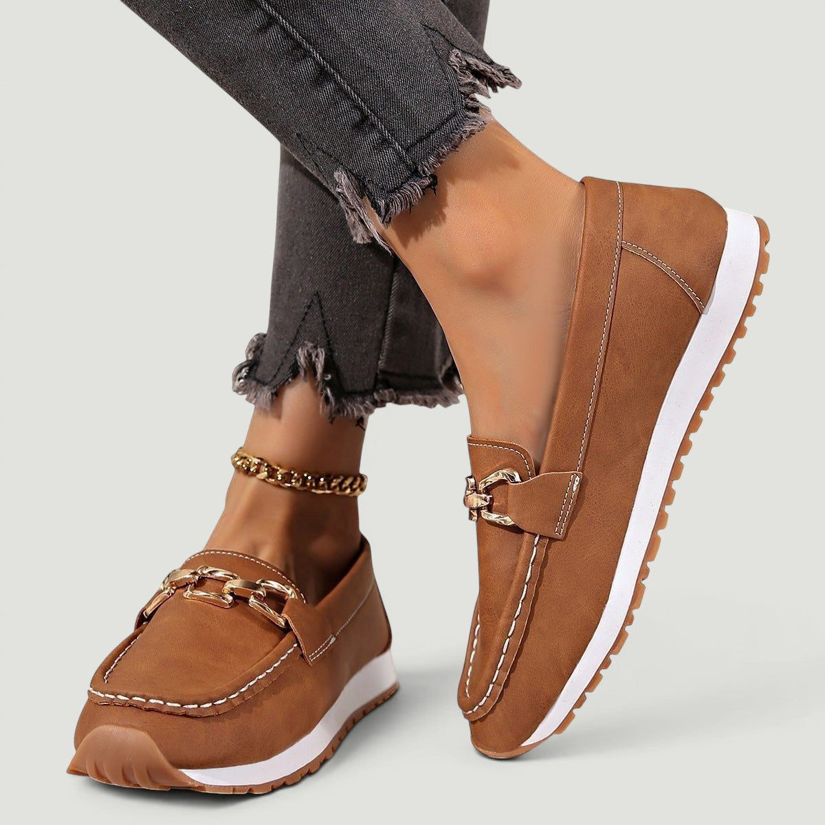 ZOFIA ATELIER brown faux suede chain platform loafers with white stitching and gold hardware.
