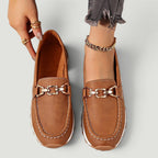ZOFIA ATELIER brown faux leather chain platform loafers with white stitching and gold hardware.