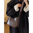 ZOFIA ATELIER brown faux leather crossbody bag with patchwork stitching and patterned strap
