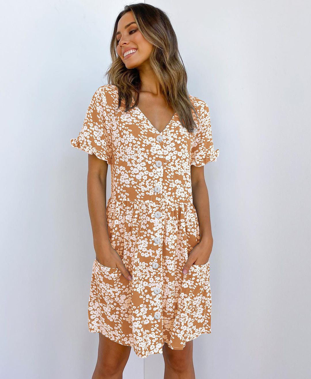 ZOFIA ATELIER brown mini dress with white floral print, V-neck, short sleeves, and button front.