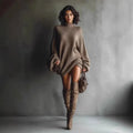 ZOFIA ATELIER brown knitted sweater dress with lantern sleeves and mock neck, worn with knee-high boots.