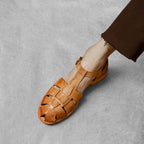 ZOFIA ATELIER brown woven leather retro Roman sandals with T-strap and buckle closure.