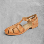 ZOFIA ATELIER brown genuine leather retro Roman sandals with woven straps and buckle closure.