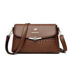 ZOFIA ATELIER brown PU leather crossbody bag with rhombus pattern and floral clasp.