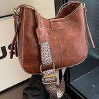 ZOFIA ATELIER brown retro crossbody bag with patchwork stitching and patterned strap. Made of PU leather.