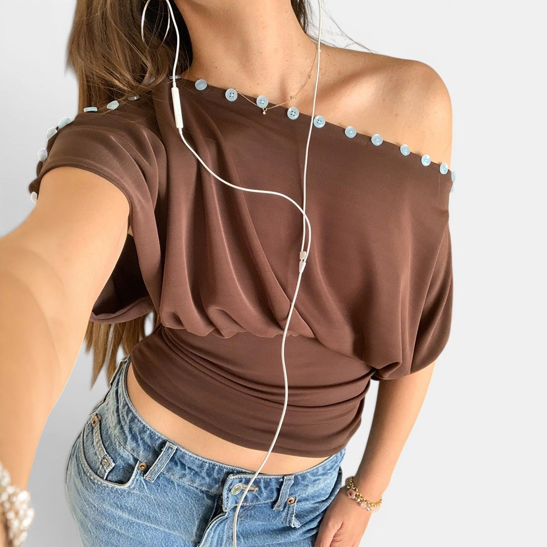 ZOFIA ATELIER warm brown 100% polyester sleeveless top with button details and defined waistline.