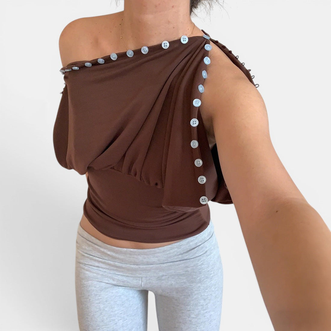 ZOFIA ATELIER warm brown sleeveless top with button details and defined waistline, made of 100% polyester.