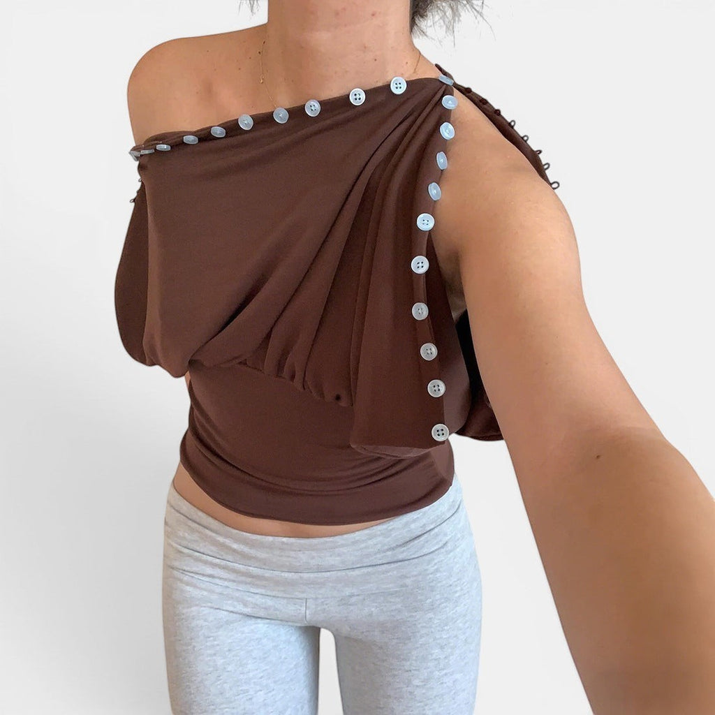 ZOFIA ATELIER warm brown sleeveless top with button details and defined waistline, made of 100% polyester.