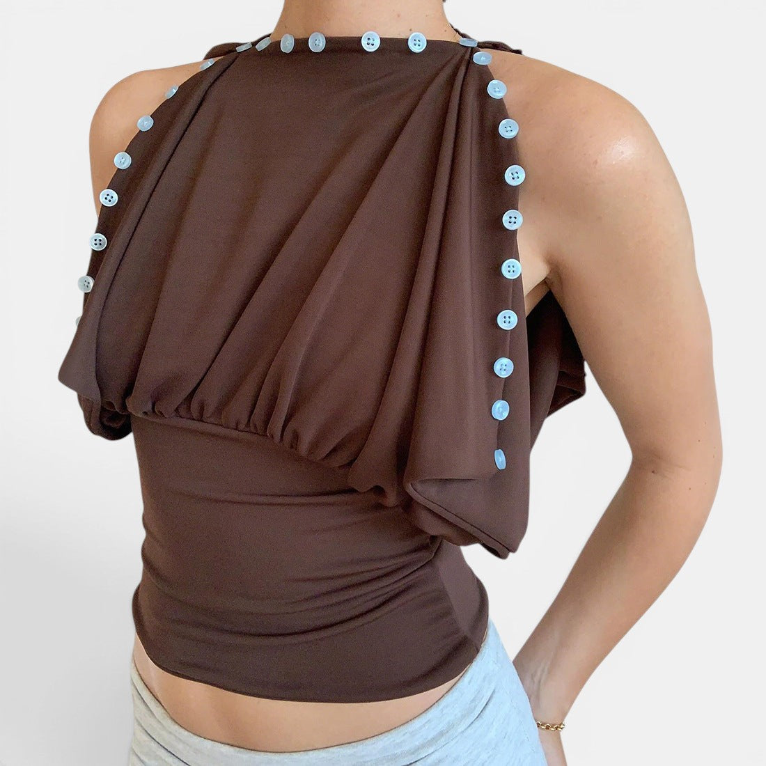 ZOFIA ATELIER warm brown sleeveless top with patchwork design and light blue button details, defined waistline, 100% polyester.