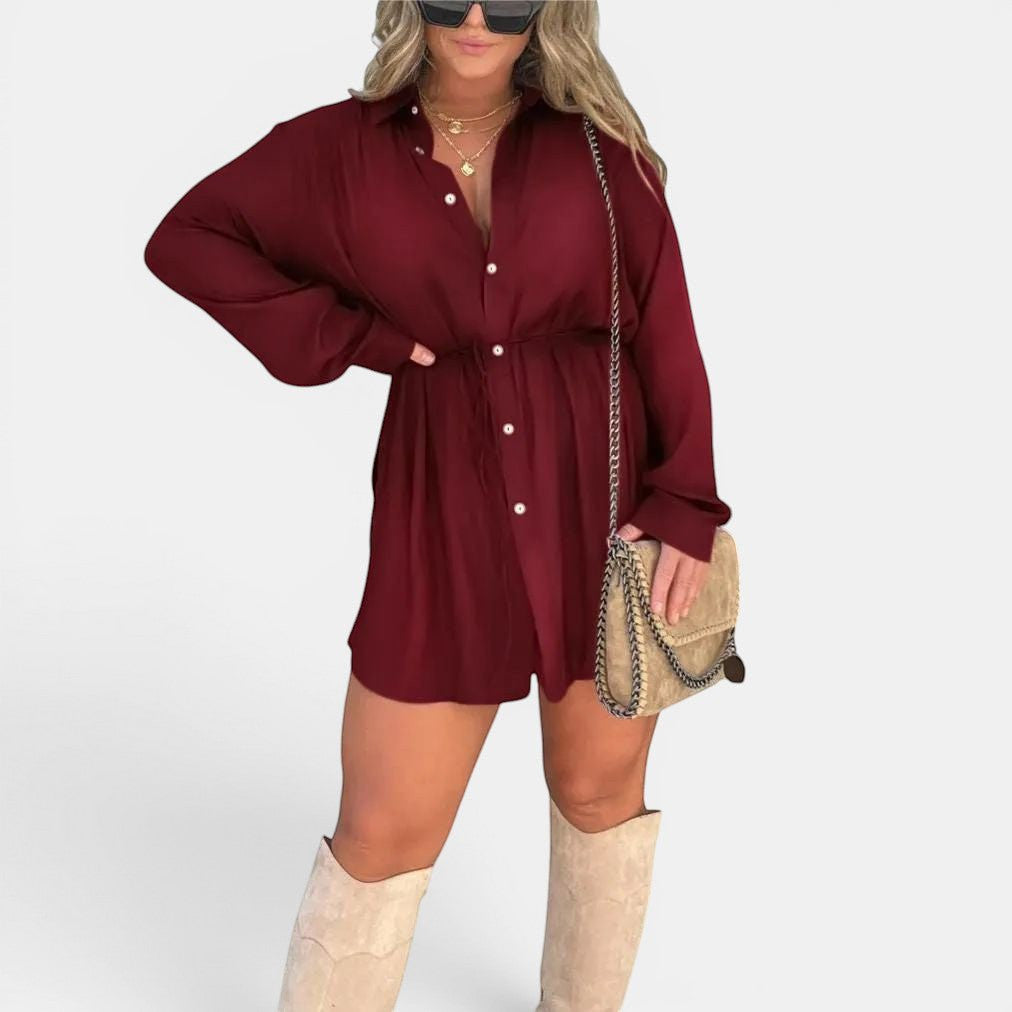 ZOFIA ATELIER burgundy spandex button-front long-sleeve jumpsuit with lace-up waist detail and shorts.