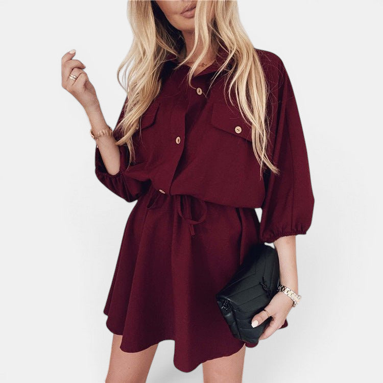 ZOFIA ATELIER burgundy shirt dress with drawstring waist, three-quarter raglan sleeves, and button-down front.