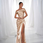 ZOFIA ATELIER champagne satin off-the-shoulder maxi dress with a high slit and draped detailing.