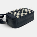 ZOFIA ATELIER black and cream chessboard pattern PU handbag with zipper closure and adjustable strap.
