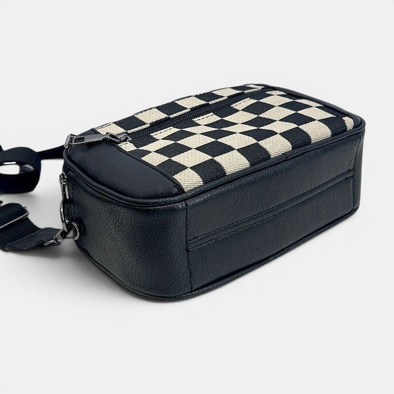 ZOFIA ATELIER black and cream chessboard pattern PU handbag with zipper closure and adjustable strap.