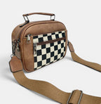 ZOFIA ATELIER brown PU handbag with black and white chessboard pattern front panel and adjustable strap.