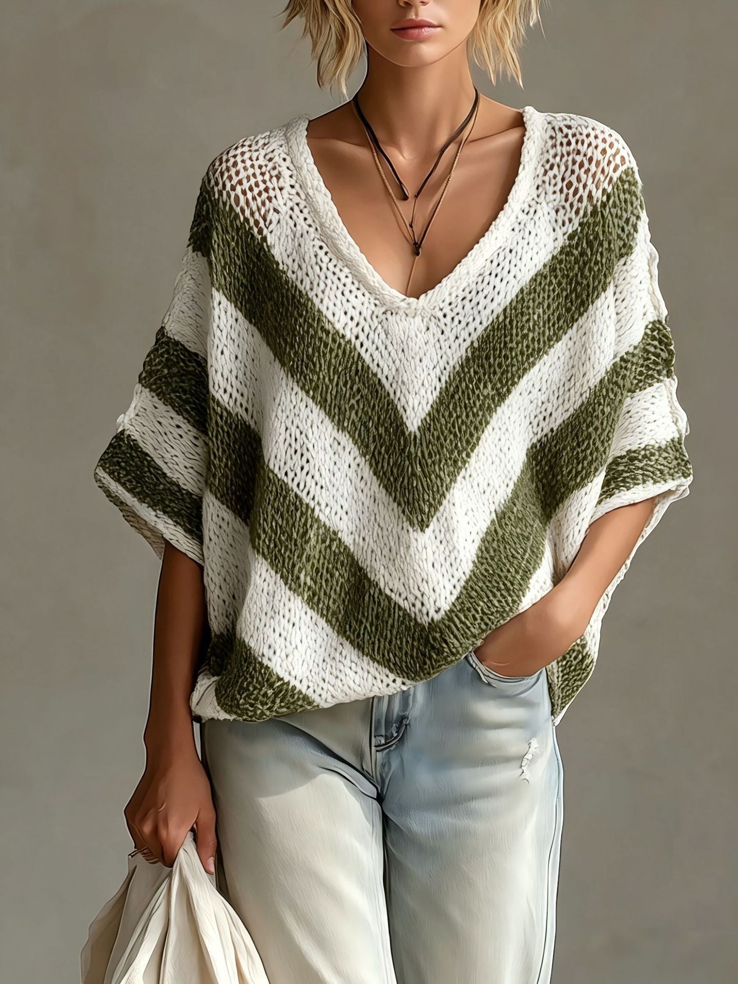 ZOFIA ATELIER V-neck loose-knit sweater with white and green chevron stripes, drop shoulder sleeves.