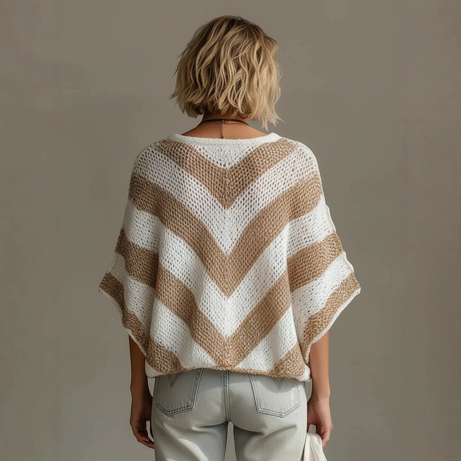 ZOFIA ATELIER white and tan chevron knit V-neck loose-fit sweater with drop shoulder sleeves.
