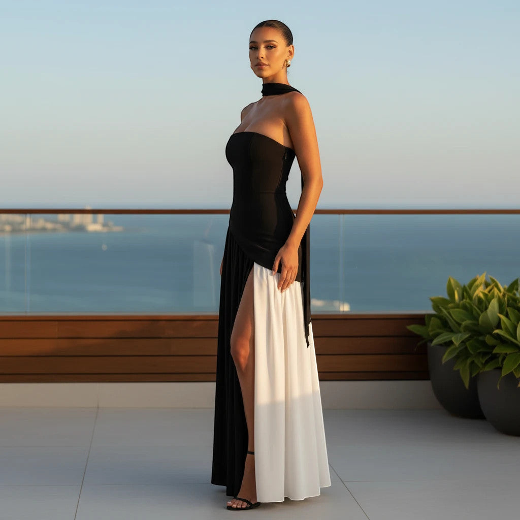 ZOFIA ATELIER black and white color block tube dress with off-the-shoulder neckline and high slit. Polyester.