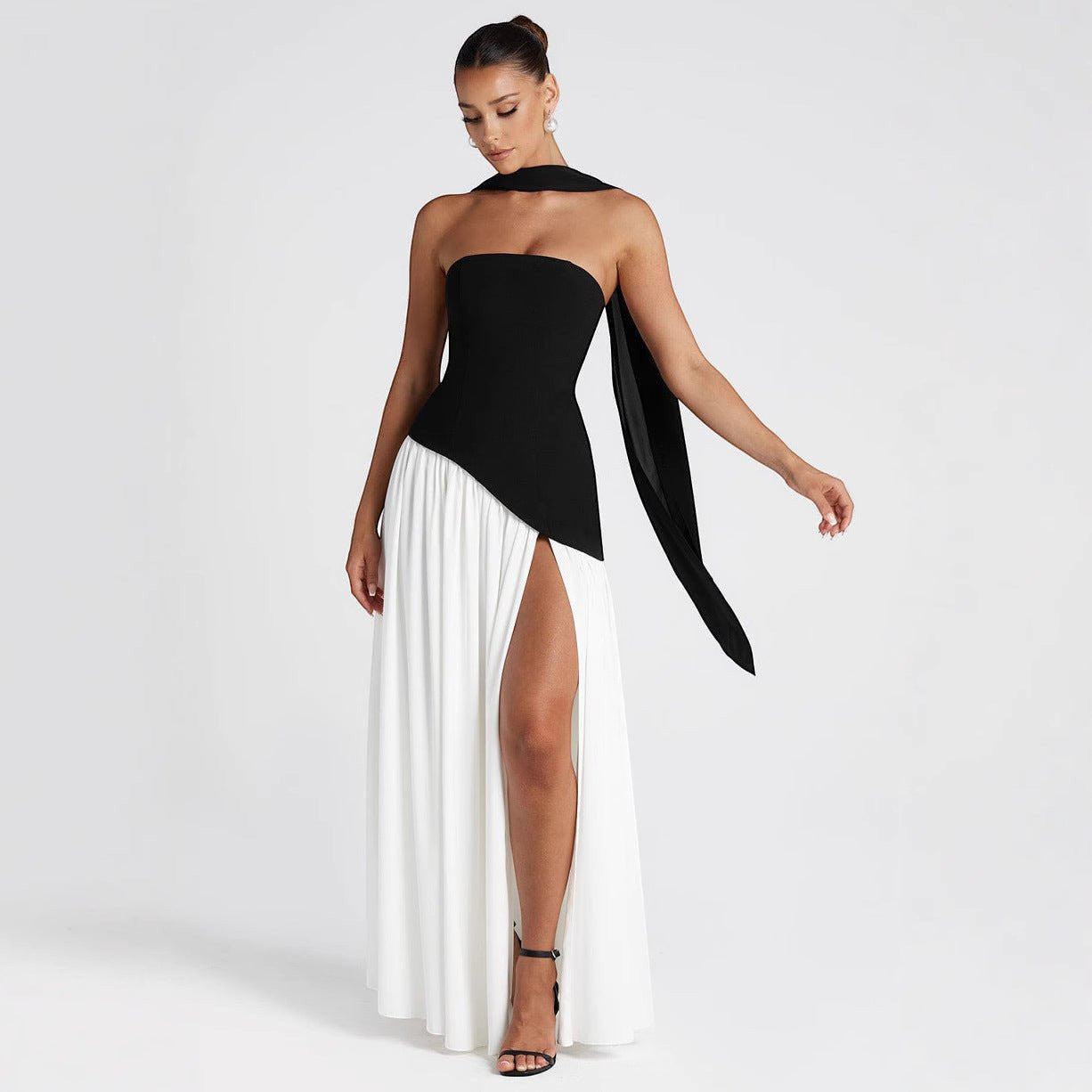 ZOFIA ATELIER black and white color block tube dress with off-the-shoulder design and high slit, made of polyester.