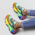 ZOFIA ATELIER colorful dad shoes with rainbow gradient sole, mint green, mustard yellow, and black accents, lace-up front, and platform sole.