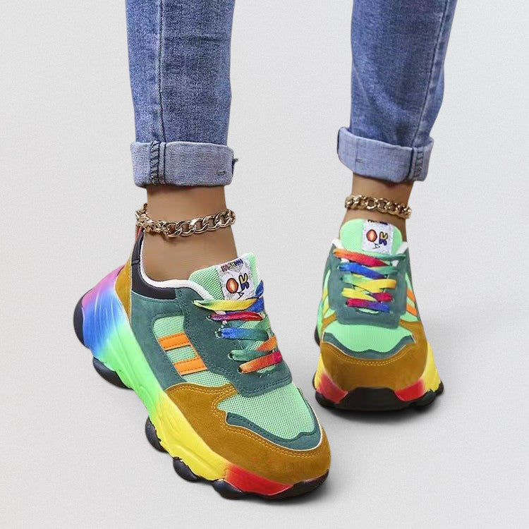 ZOFIA ATELIER colorful dad shoes with rainbow sole, green, orange, yellow, and red accents, and rainbow laces.