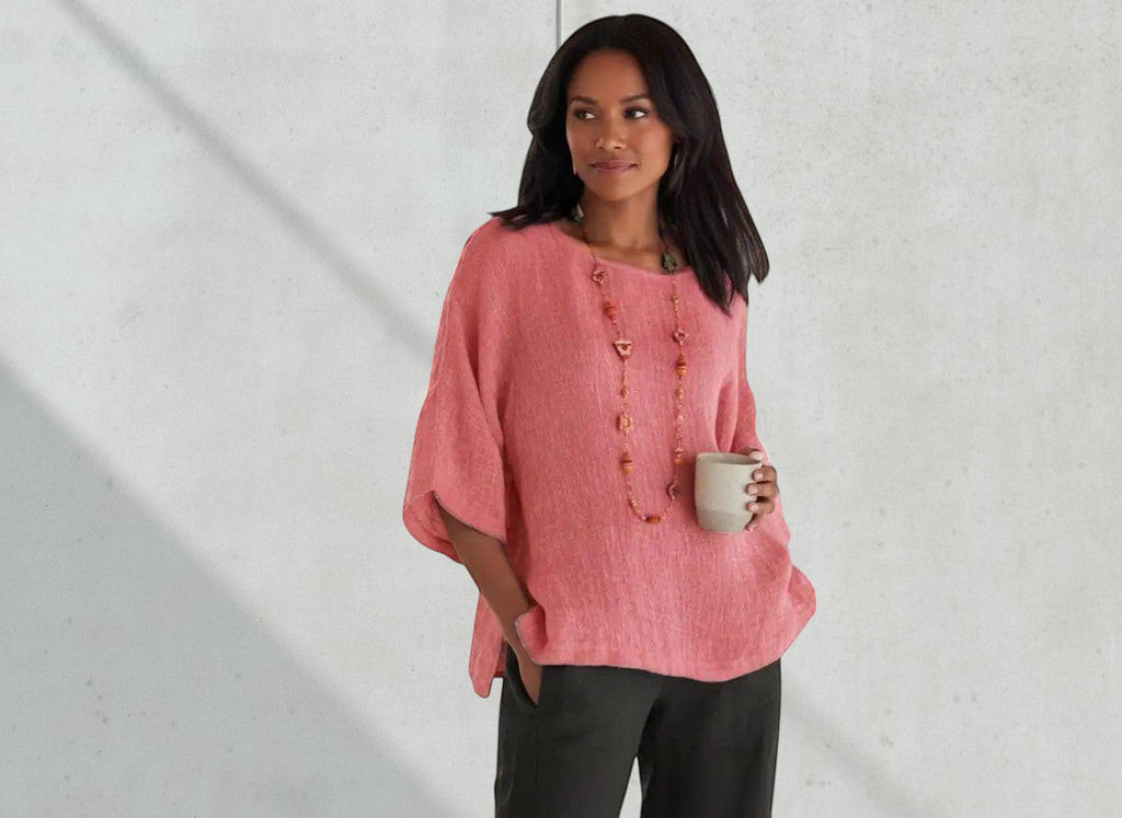 ZOFIA ATELIER coral linen blend relaxed fit blouse with wide sleeves and a boat neck, worn by a woman holding a mug.