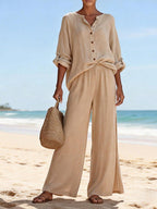 ZOFIA ATELIER beige cotton lounge set with V-neck long sleeve top and wide-leg pants on beach