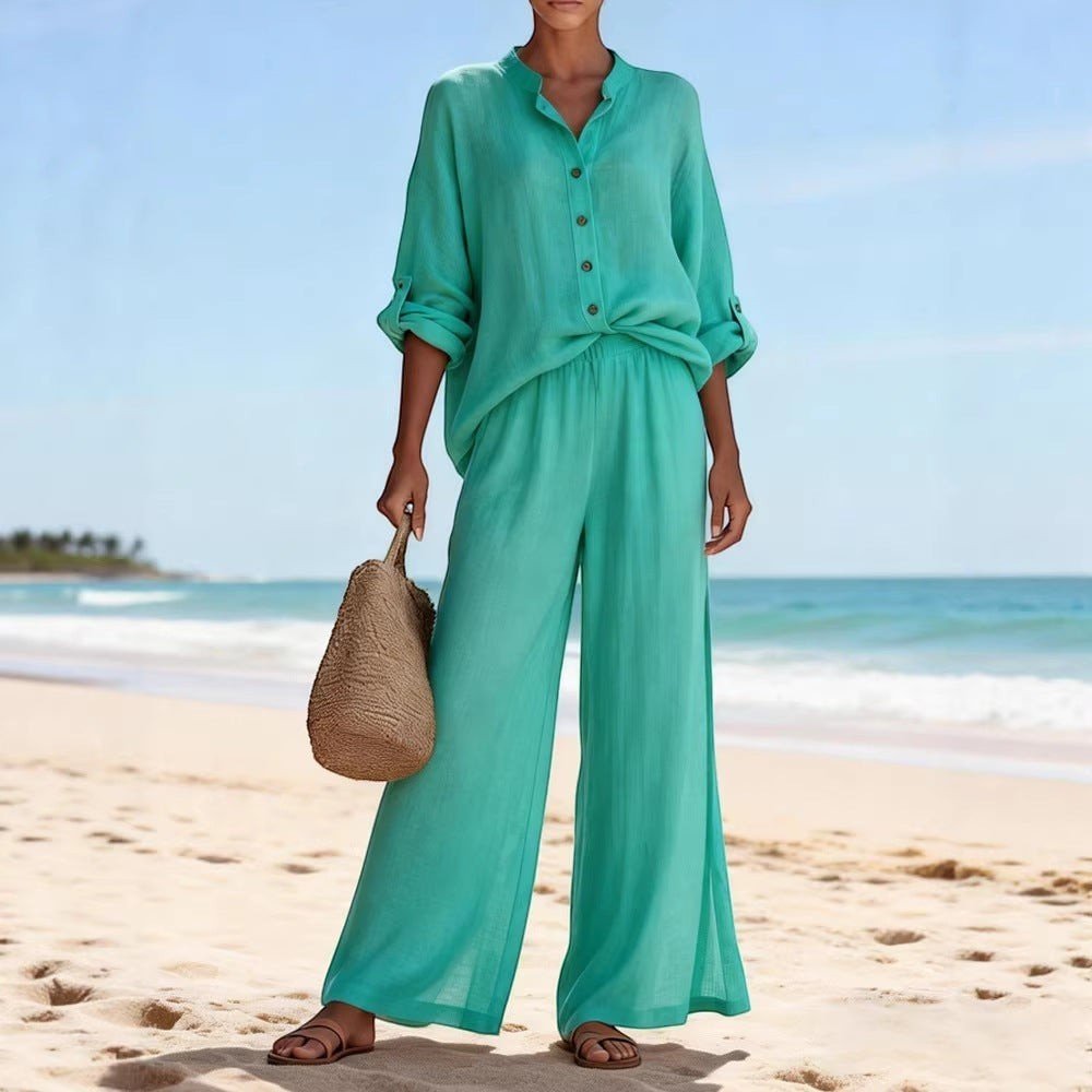 ZOFIA ATELIER turquoise cotton lounge set with V-neck long sleeve top and wide-leg pants on beach.