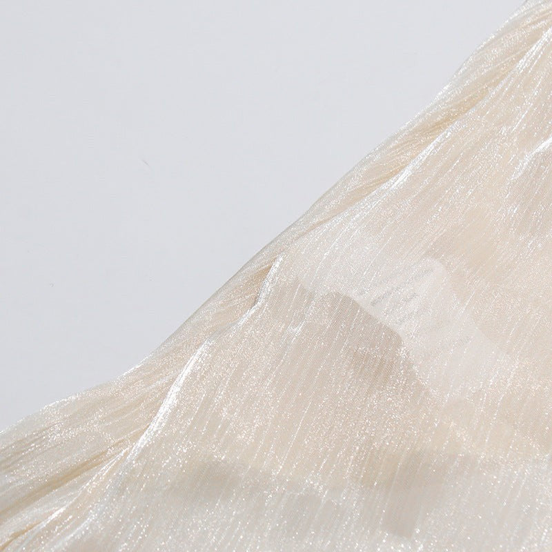 ZOFIA ATELIER cream cold-shoulder blouse with billowy sleeves and high-low hem. Lightweight, flowy fabric.
