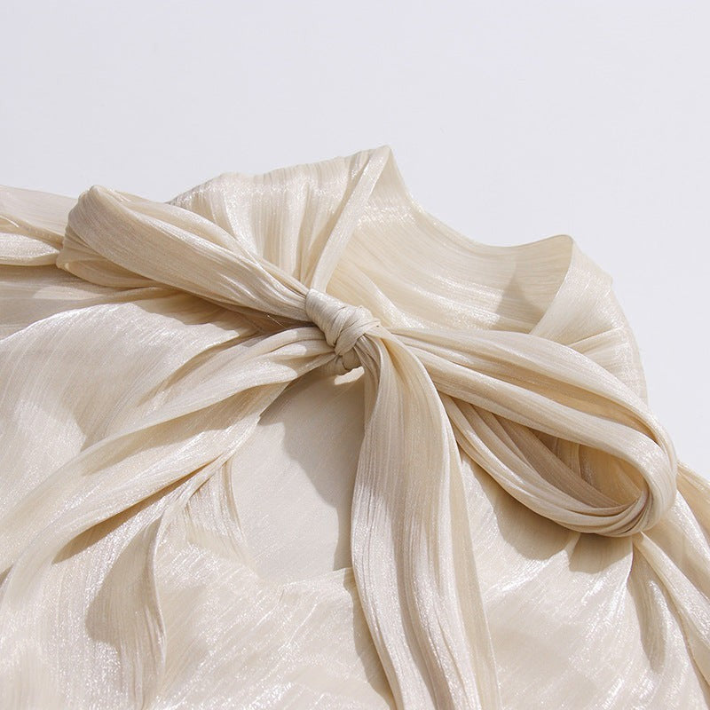 ZOFIA ATELIER cream cold-shoulder blouse with billowy sleeves and a tie detail. Lightweight, flowy fabric.