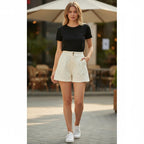 ZOFIA ATELIER cream jacquard textured mid-rise hot pants with slight stretch and button detail.