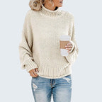 ZOFIA ATELIER cream chunky knit turtleneck sweater with relaxed fit and ribbed cuffs and hem.