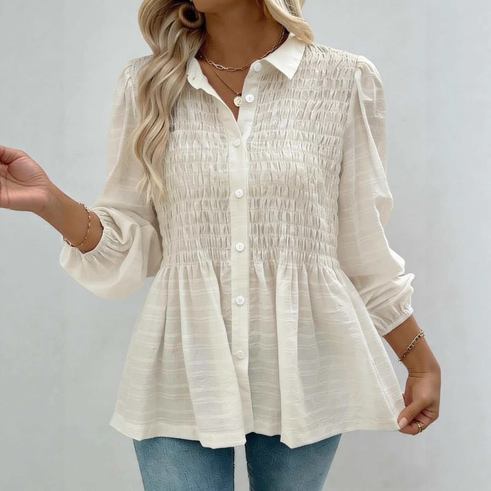 ZOFIA ATELIER cream polyester button-down shirt with smocked bodice and puff sleeves.