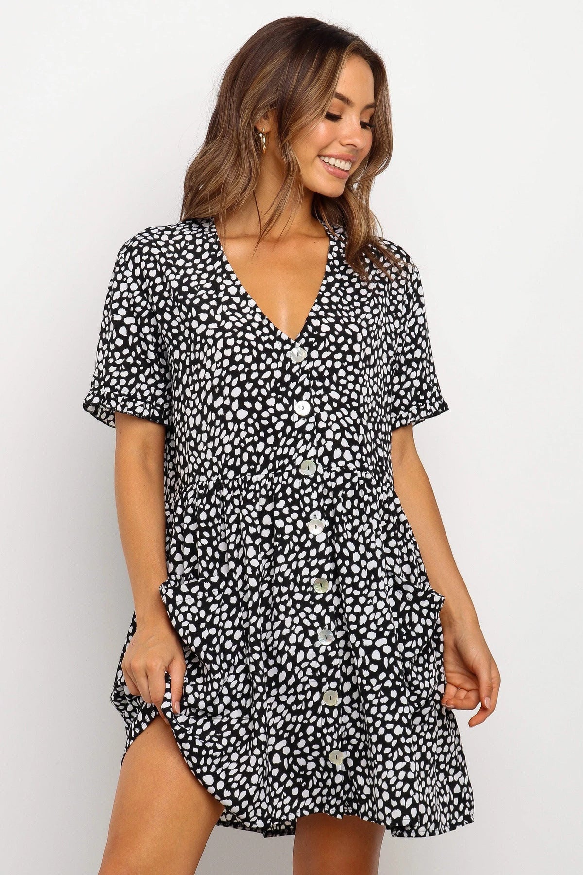 ZOFIA ATELIER black and white dalmatian dot print mini dress with V-neck and loose waist.