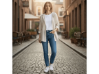 ZOFIA ATELIER DANUTA elegant hooded blouse in beige and white stripes, worn by a woman with blue jeans and white sneakers.