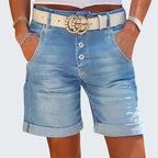 ZOFIA ATELIER light blue denim cropped shorts with button fly and rolled hem. High-waisted fit.