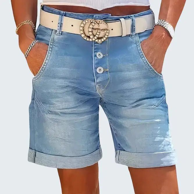 ZOFIA ATELIER light blue denim cropped shorts with button fly and rolled hem. High-waisted fit.