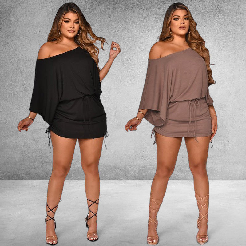 ZOFIA ATELIER black and brown dolman sleeve smocked mini dress made of milk silk with a drawstring waist and ruched sides.