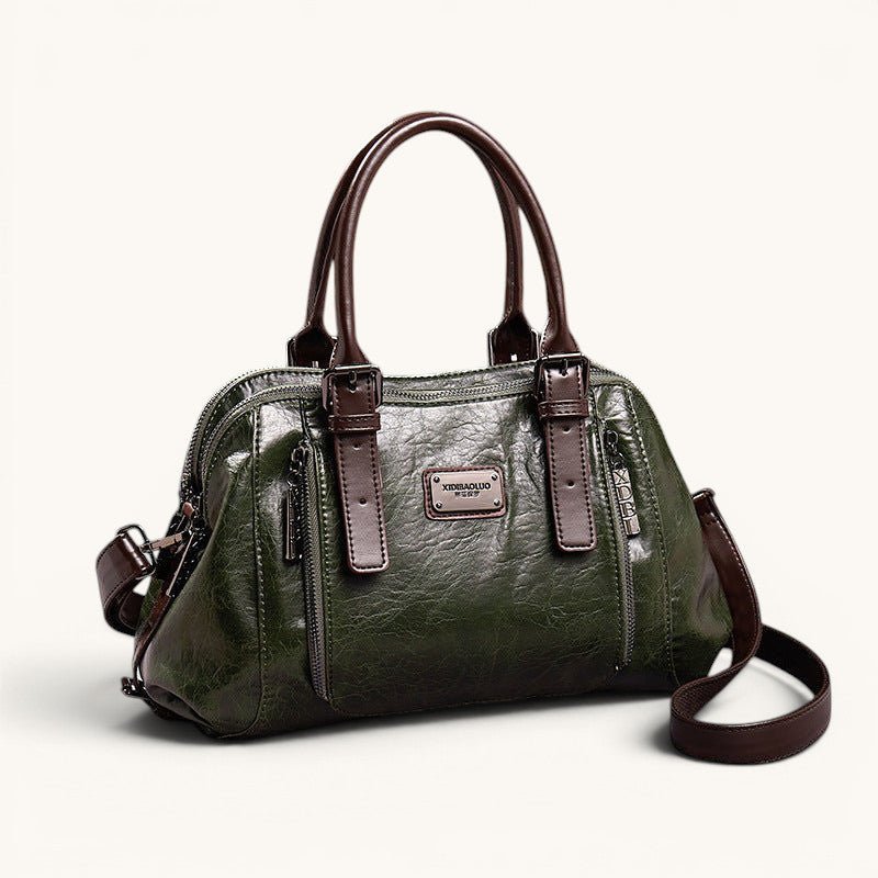 ZOFIA ATELIER Dominika olive green soft leather messenger bag with adjustable strap and zipper closure.