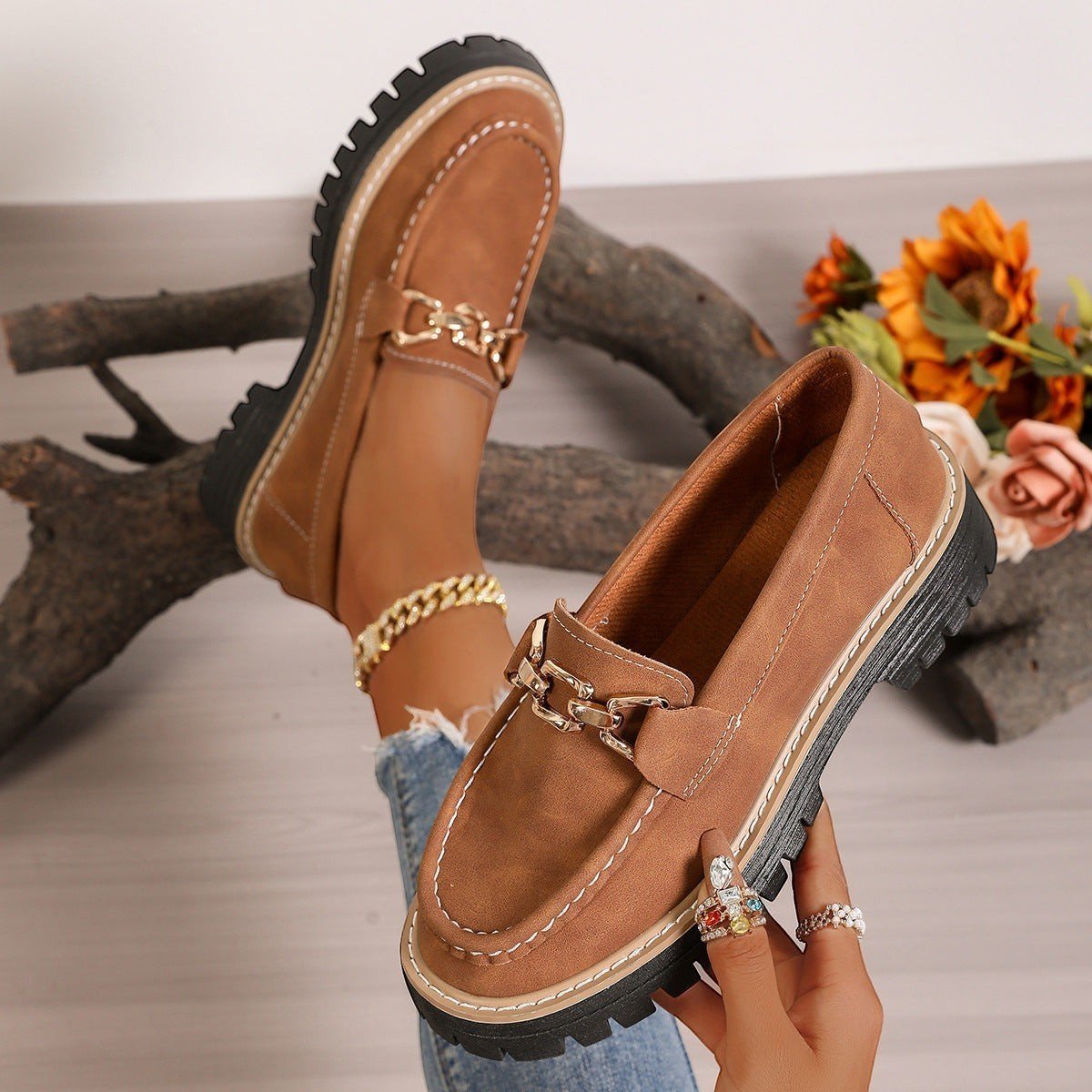 ZOFIA ATELIER DOROTA chunky platform loafers in brown faux suede with gold chain detail and white stitching.